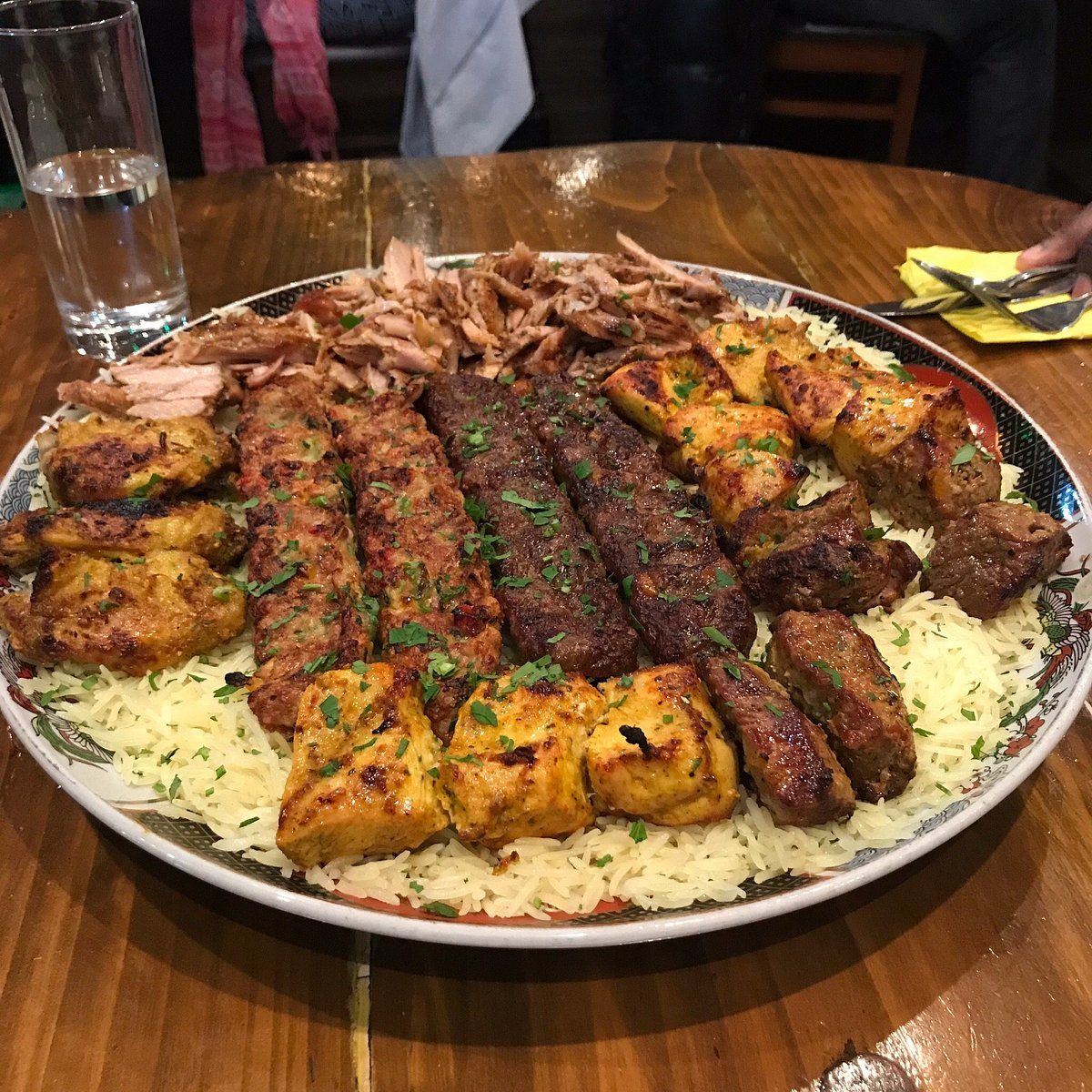 Syrian mezze and grilled meats on the table at Shaam Nights on City Road, Cardiff